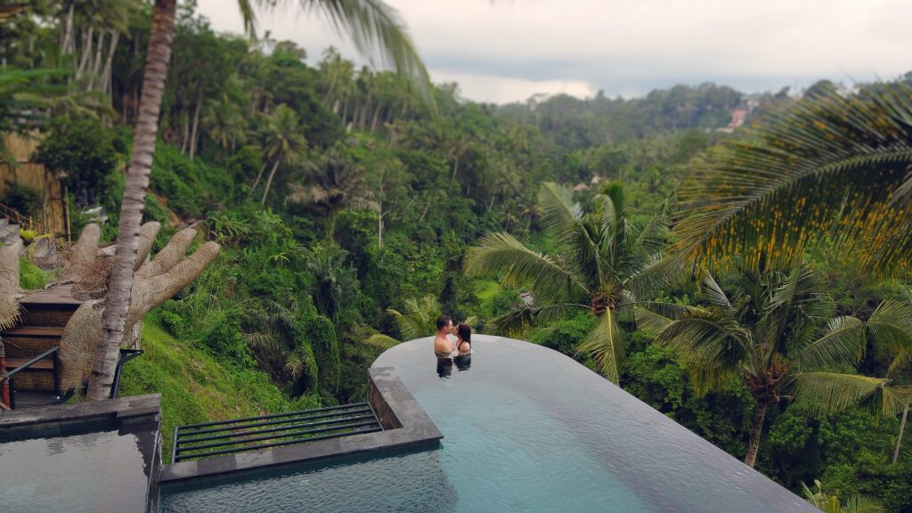 couple in pool in jungle