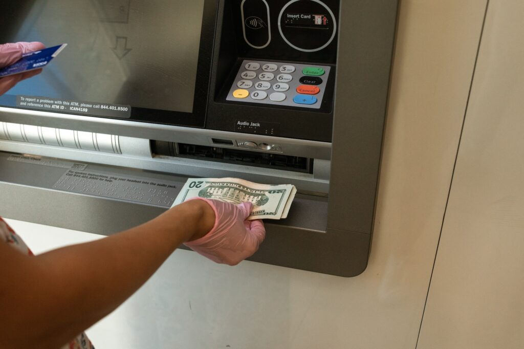 person withdrawing cash from ATM