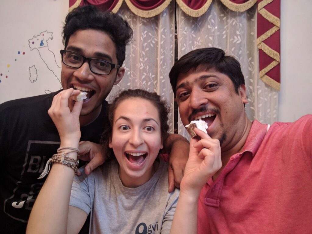 girl with two men eating cake