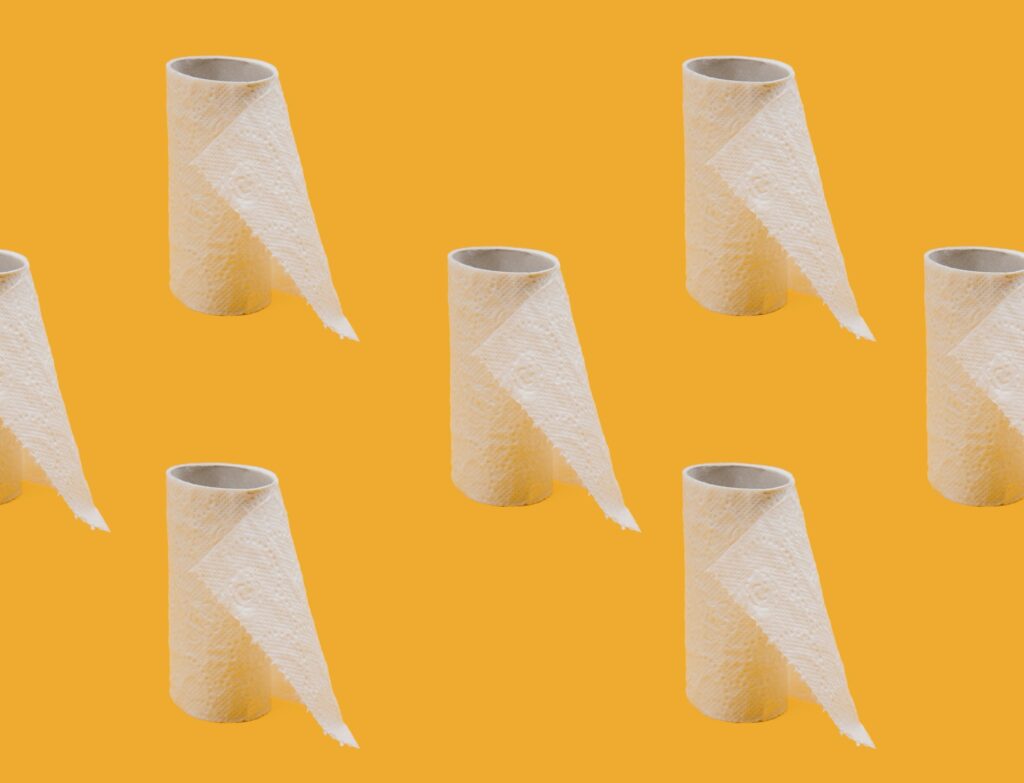 toilet paper rolls on yellow background