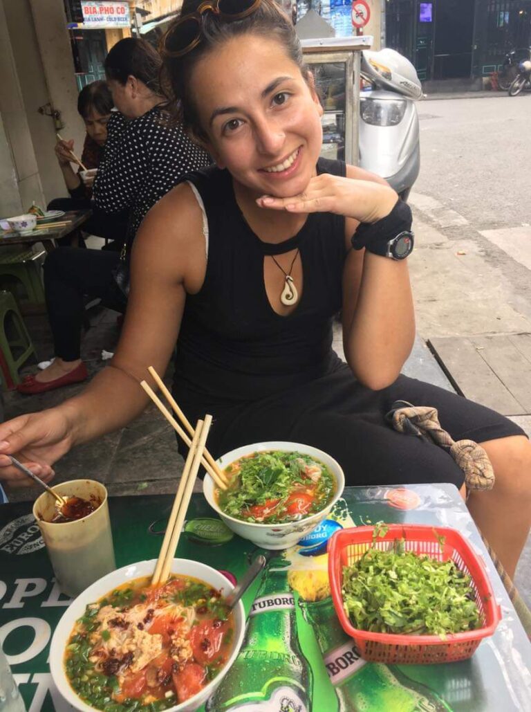 girl eating vietnamese noodles